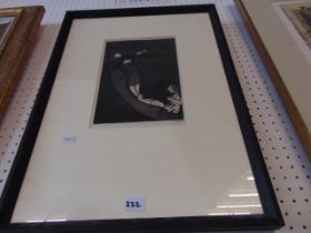 A framed etching by Laura Knight