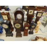 Ten miniature grandfather clocks