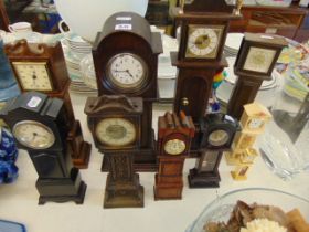 Ten miniature grandfather clocks