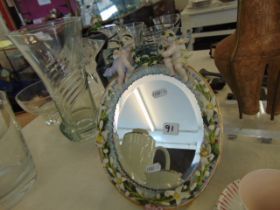 A Meissen style vanity mirror