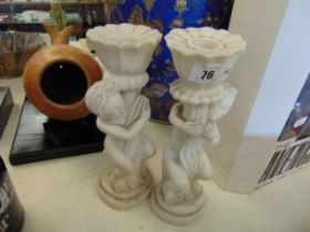 A pair of marble candlesticks