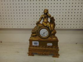 A brass mantle clock
