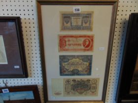 A framed set bank notes