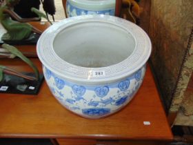 A blue and white fishbowl
