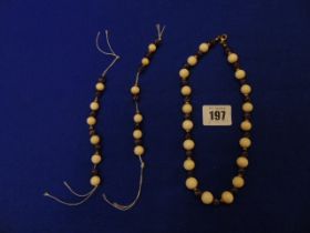 An Amethyst and bone necklace and matching spare beads