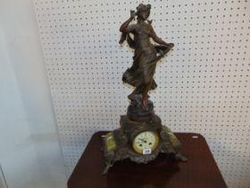 A Spelter figural clock,