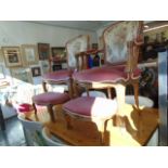 A pair of decorative salon chairs and stools