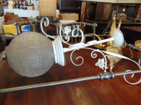 A brass three tier chandelier and other lamp