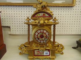 An Ormulu and porcelain mantle clock