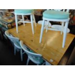 A decorative kitchen table and six chairs