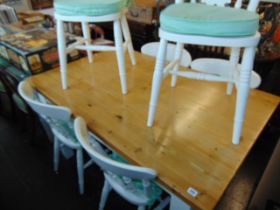 A decorative kitchen table and six chairs