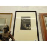 A framed etching by Laura Knight