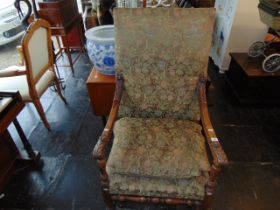 A 19th century upholstered armchair