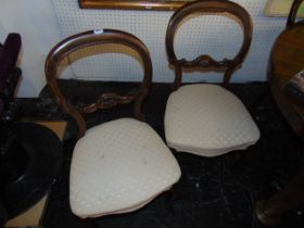 A set of six Victorian balloon back chairs