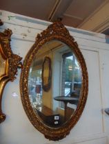 A gilt framed mirror