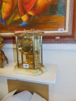 An Onyx and glass mantle clock