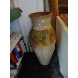 A large terracotta garden urn