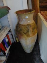 A large terracotta garden urn