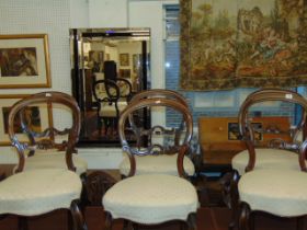 A set of six Victorian balloon back chairs