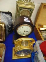 Two decorative clocks and a barometer