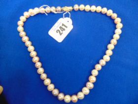 A Cultured Pearl necklace with 18ct GOld clasp set with Diamond