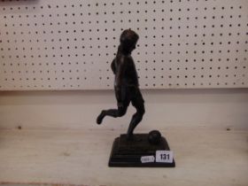 A Bronze model of a footballer