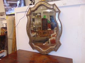 An executive bevelled gilt framed mirror