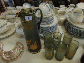 A Bohemian overlay jug and six matching tall glasses, good condition,