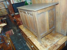 An Oak linefold blanket box