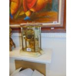 An Onyx and glass mantle clock