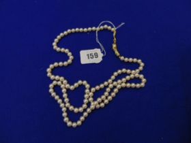 A Pearl necklace with Artdeco Snake clasp set with centre garnet
