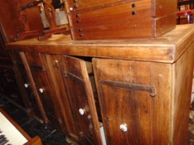 An Indian Teak four door cupboard