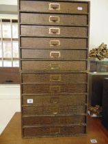 Three sets of filing drawers