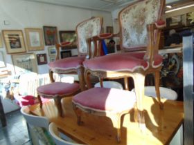 A pair of decorative salon chairs and stools