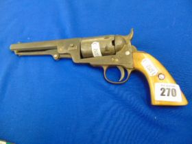 A navy Colt revolver a.