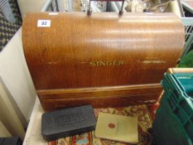 A singer sewing machine in case