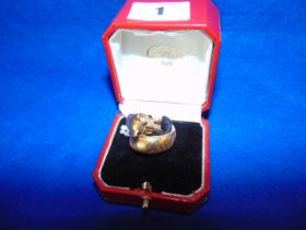 A Cartier 18ct Gold Panther expandable ring with box