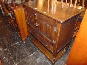 An linen fold cupboard