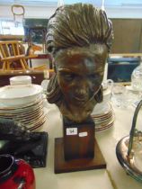 A bronze bust of a lady,