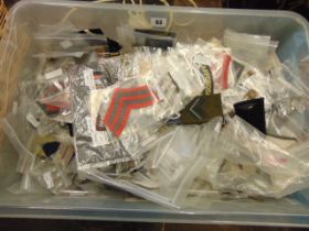 A large qty of military buttons and badges