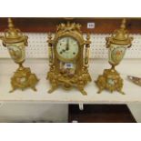 A gilt clock garniture set