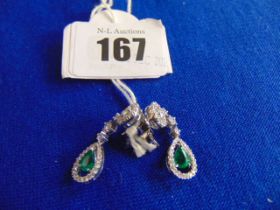 An 18ct White Gold Emerald and Diamond drop earrings