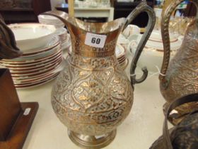 A large Copper middle eastern jug