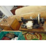 A Singer sewing machine in case