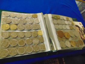 A qty of assorted coins in folder