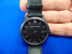 A black leather strap auto watch,
