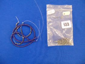 A strand of small Lapis Lazuli and a ditto Hematite beads