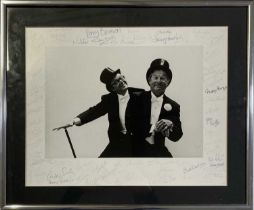 ERIC MORECAMBE AND ERNIE WISE - LARGE PHOTOGRAPH WITH 50+ SIGNATURES FROM STARS OF STAGE AND SCREEN