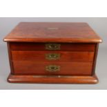 A mahogany table top three drawer cutlery cabinet. 26cm x 52cm x 42cm. Cabinet is empty.