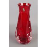 A Whitefriars red glass 'Knobbly' vase. 25cm tall.